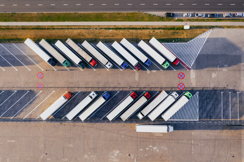 trucksparkedbesidehighway | Limepack The world of paper cups | Limepack trucks parked beside highway